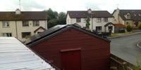 Thumbnail for Solar panels installed on shed roof in residential area