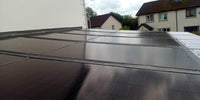 Thumbnail for Roof-mounted solar panels on residential building